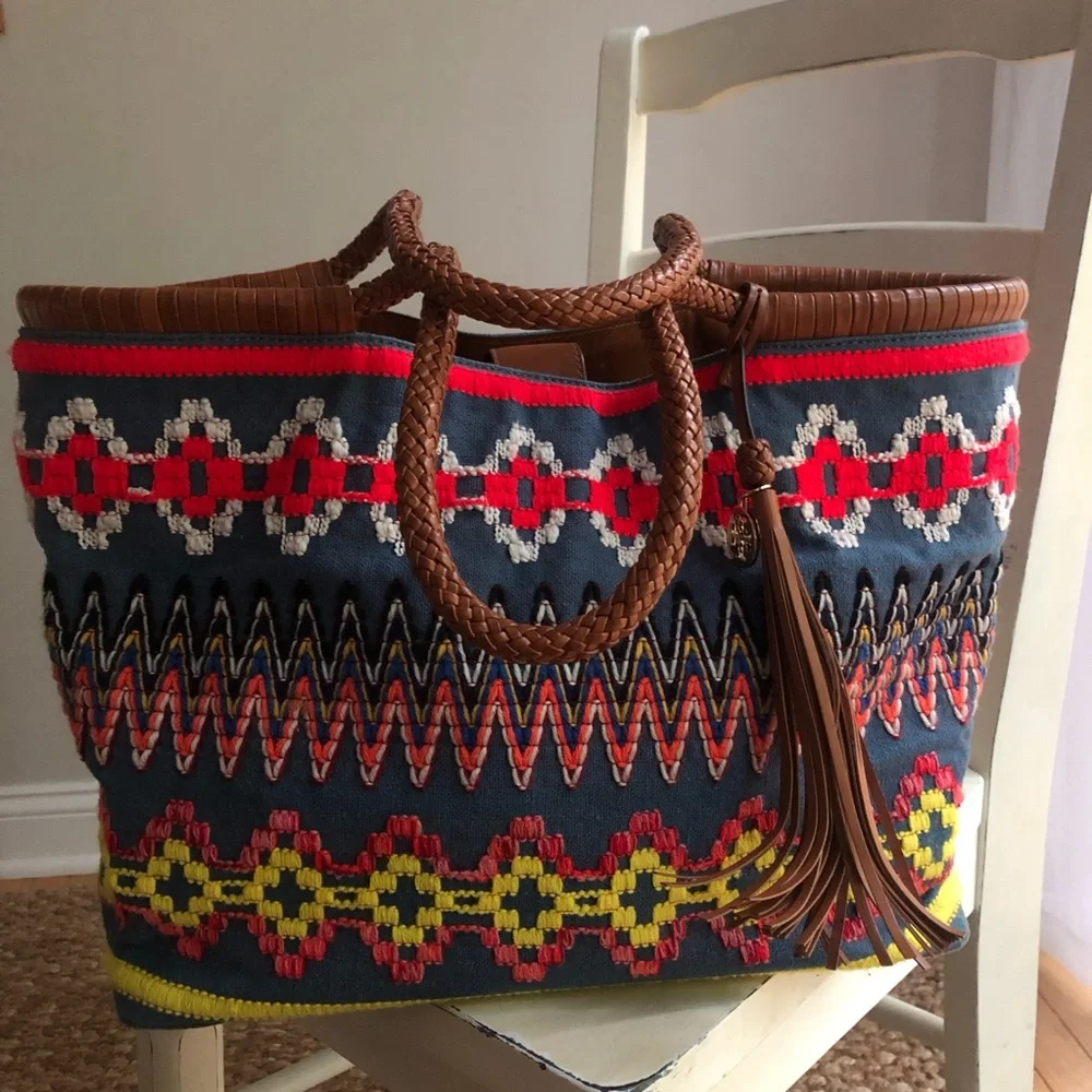 Tory Burch measured approximately
